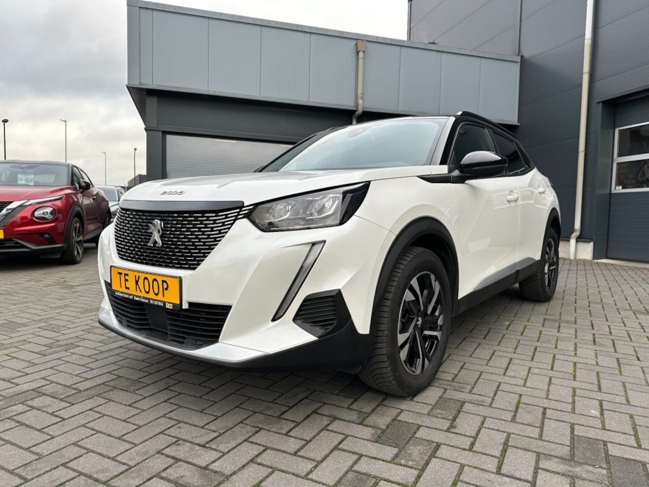 Peugeot 2008 - 1.2 PureTech Allure Aut. Navi. Camera - AutoWereld.nl