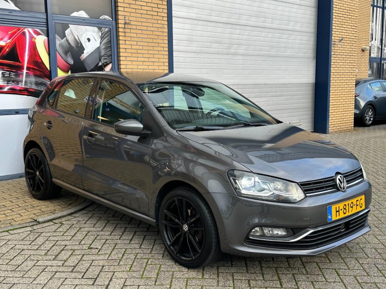 Volkswagen Polo - 1.2 TSI Highline 1.2 TSI Highline, APK, onderhoudshistorie, PDC, cruise control, stuurwielbediening, lichtm - AutoWereld.nl
