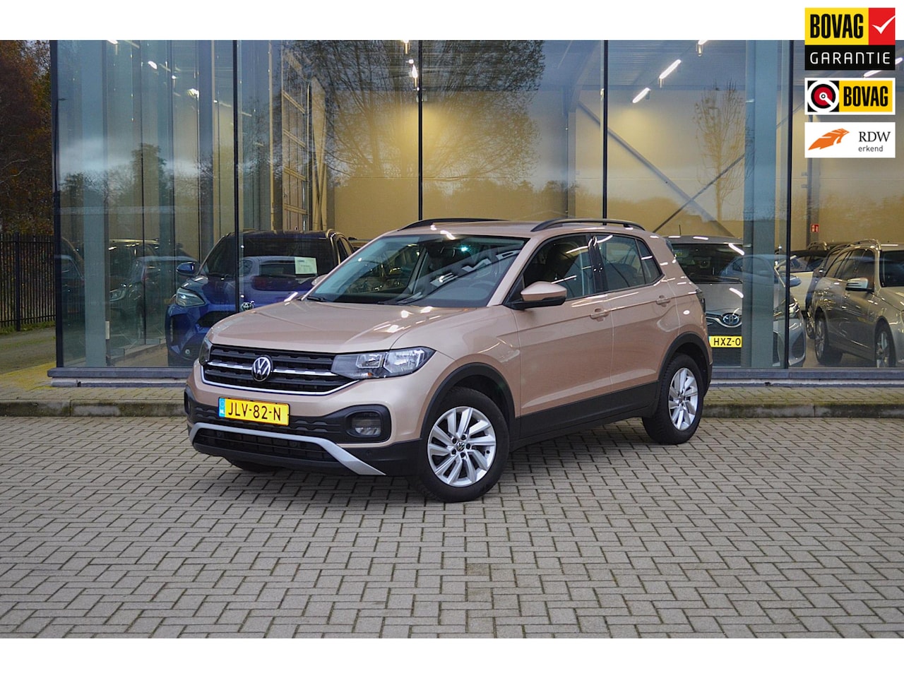 Volkswagen T-Cross - 1.0 TSI Style | Trekhaak | Automaat | Stoelverwarming | Adaptive Cruise Control | Goud - AutoWereld.nl