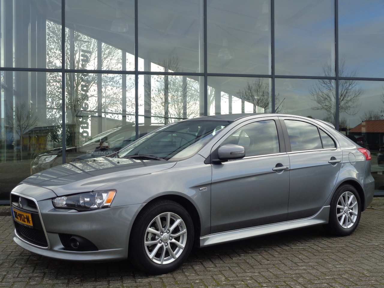 Mitsubishi Lancer Sportback - 1.6 Limited Edition | Uniek | NL Auto | Weinig km | Stoelverwarming | Climate | LMV | Navi | Parkeersensoren - AutoWereld.nl