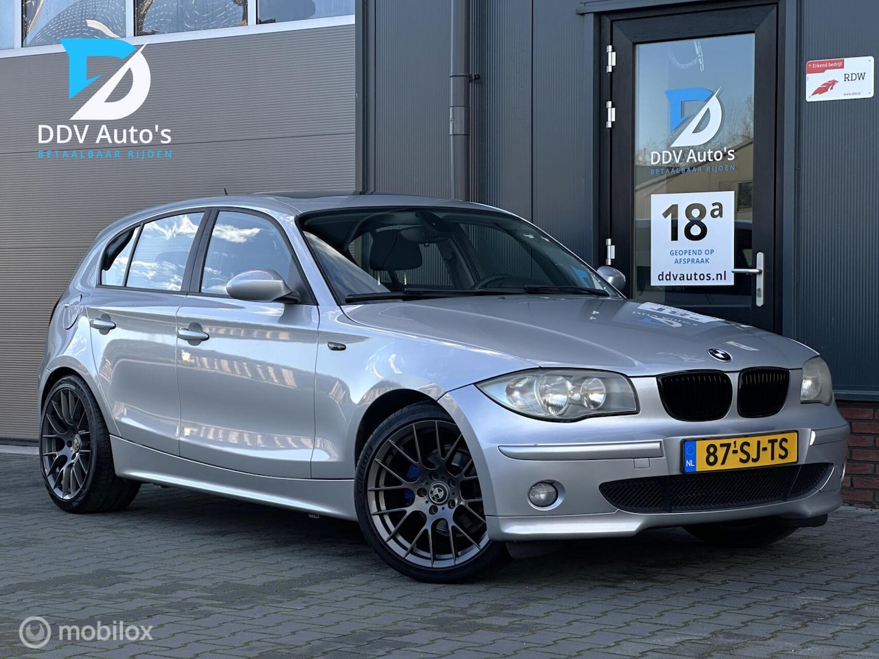 BMW 1-serie - 118i/129pk|2006|NAP|Schuif-/Kanteldak|18"LMV|Airco|Org. NL - AutoWereld.nl
