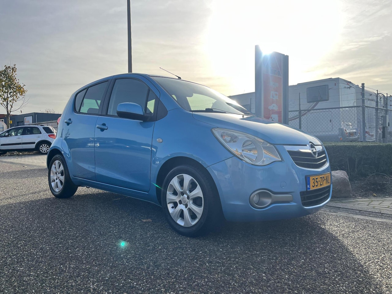 Opel Agila - 1.2 Enjoy | Parkeersensoren achter | Airco | 5D | Elektrisch bedienbare spiegels en ramen - AutoWereld.nl