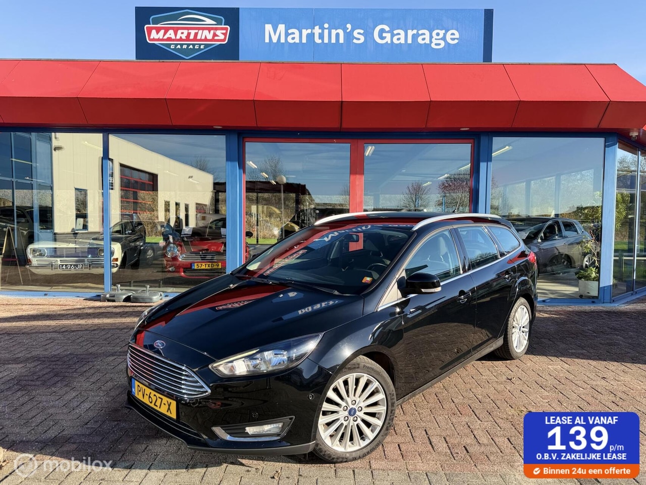 Ford Focus Wagon - 1.0 Titanium PDC NAVI CRUISE CLIMA - AutoWereld.nl