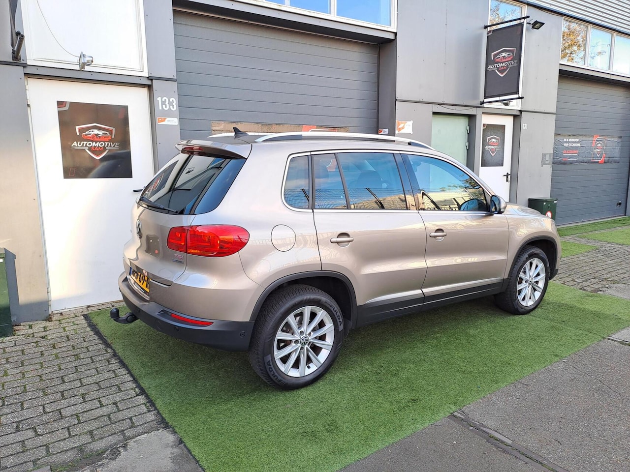 Volkswagen Tiguan - 1.4 TSI Sport&Style Climate Cruise Navi - AutoWereld.nl