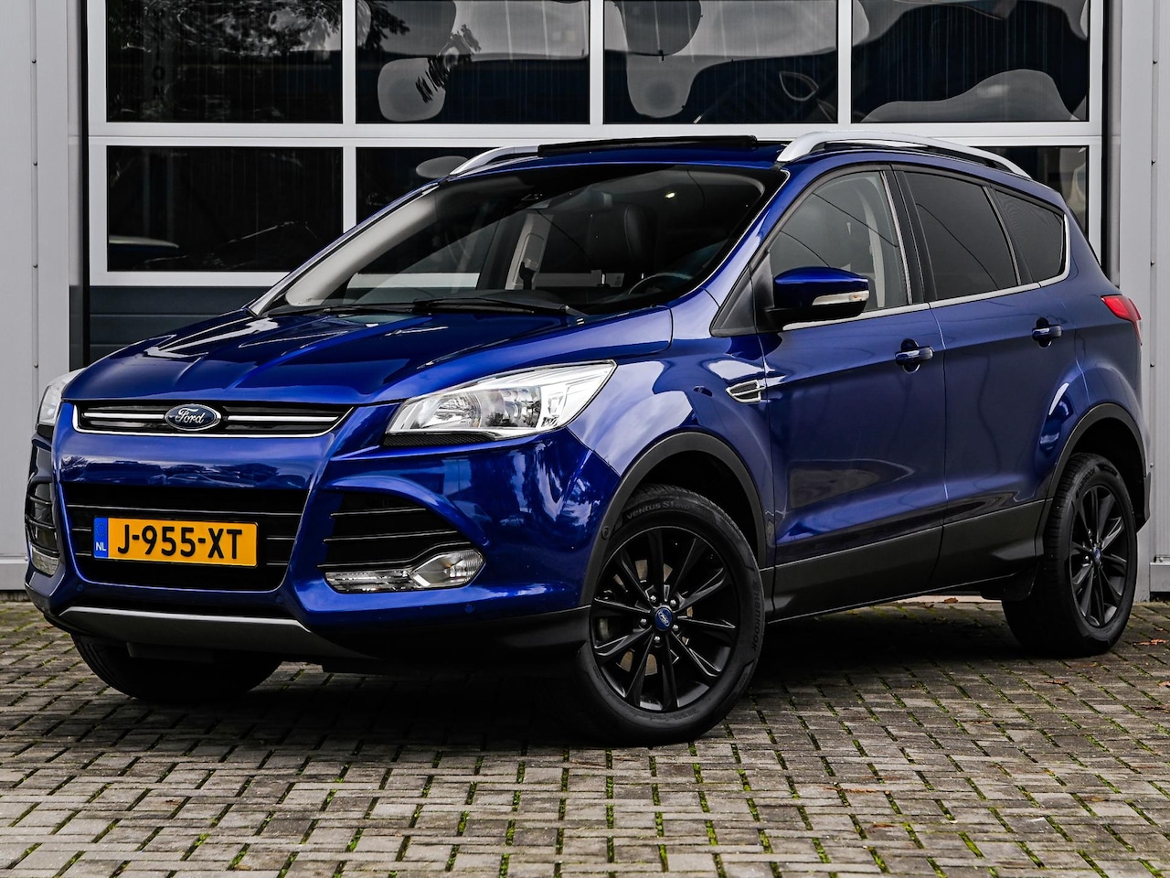 Ford Kuga - 1.5 Titanium Styling Pack | Panoramadak | PDC v+a | Climate control | Cruise control | Tre - AutoWereld.nl
