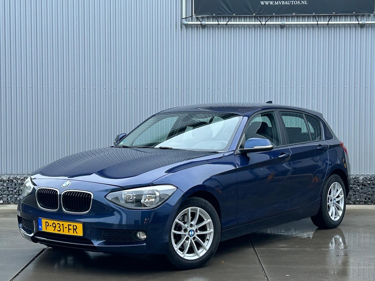 BMW 1-serie - 116i High Executive 116i High Executive, navi, stoelverwarming, cruise - AutoWereld.nl