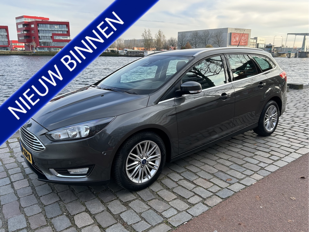 Ford Focus Wagon - 1.0 Titanium airco/ecc navi/camera keurige auto - AutoWereld.nl