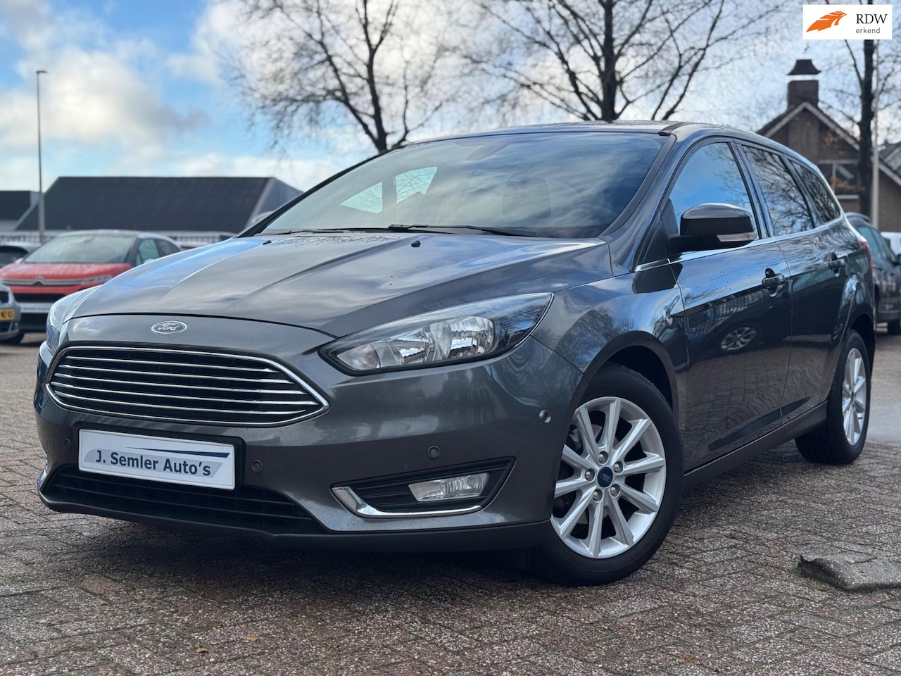 Ford Focus Wagon - 1.0 Titanium NAVI CRUISE PDC PARK HULP KEYLESS GO TREKHAAK - AutoWereld.nl