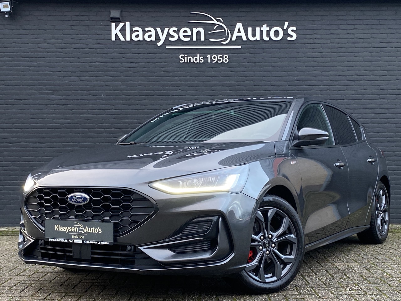 Ford Focus - 1.0 EcoBoost Hybrid 125 pk ST Line AUT. | 1e eigenaar | dealer onderh. | winter pakket | n - AutoWereld.nl