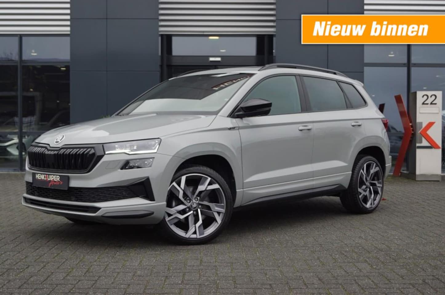 Skoda Karoq - 1.5 TSI DSG Sportline 150pk/Trekhaak wegklb./Panodak/ Navi Columbus/ACC/DCC/Camera - AutoWereld.nl