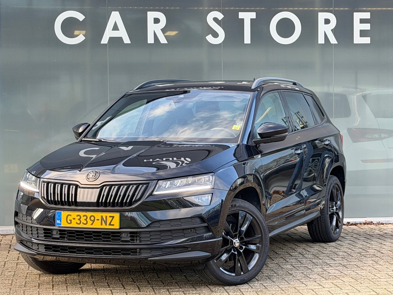 Skoda Karoq - 1.5 TSI DSG Sportline Pano|Sfeer|Canton|Dealer O - AutoWereld.nl