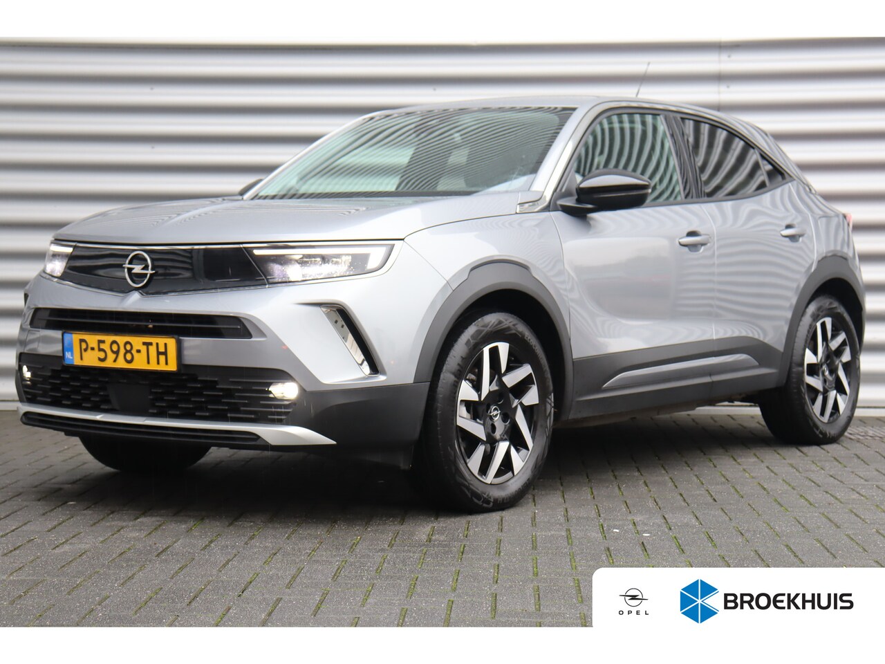 Opel Mokka-e - 50KWH 136PK ELEGANCE AUTOMAAT / NAVI / LEDER / CLIMA / LED / PDC / 17" LMV / CAMERA / WINT - AutoWereld.nl