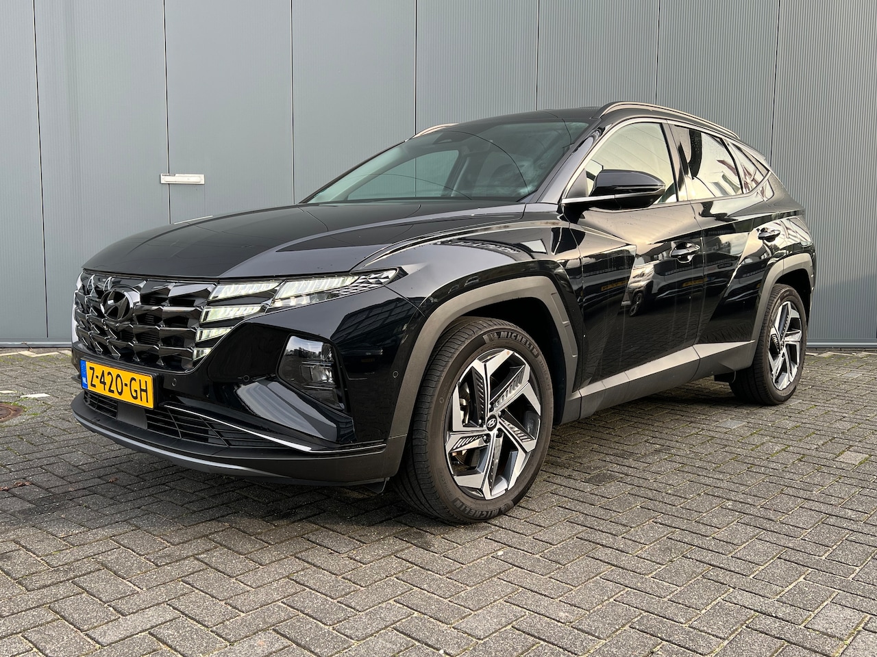 Hyundai Tucson - 1.6 T-GDI PHEV 265pk Premium 4WD | Leder | Carplay | Climate | Keyless | Navigatie | Elek. - AutoWereld.nl