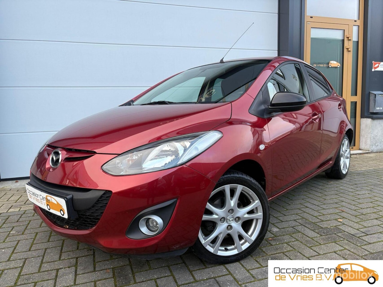Mazda 2 - 1.3 Airco Velgen Navi/Carplay Stoelverwarmd Trekhaak - AutoWereld.nl