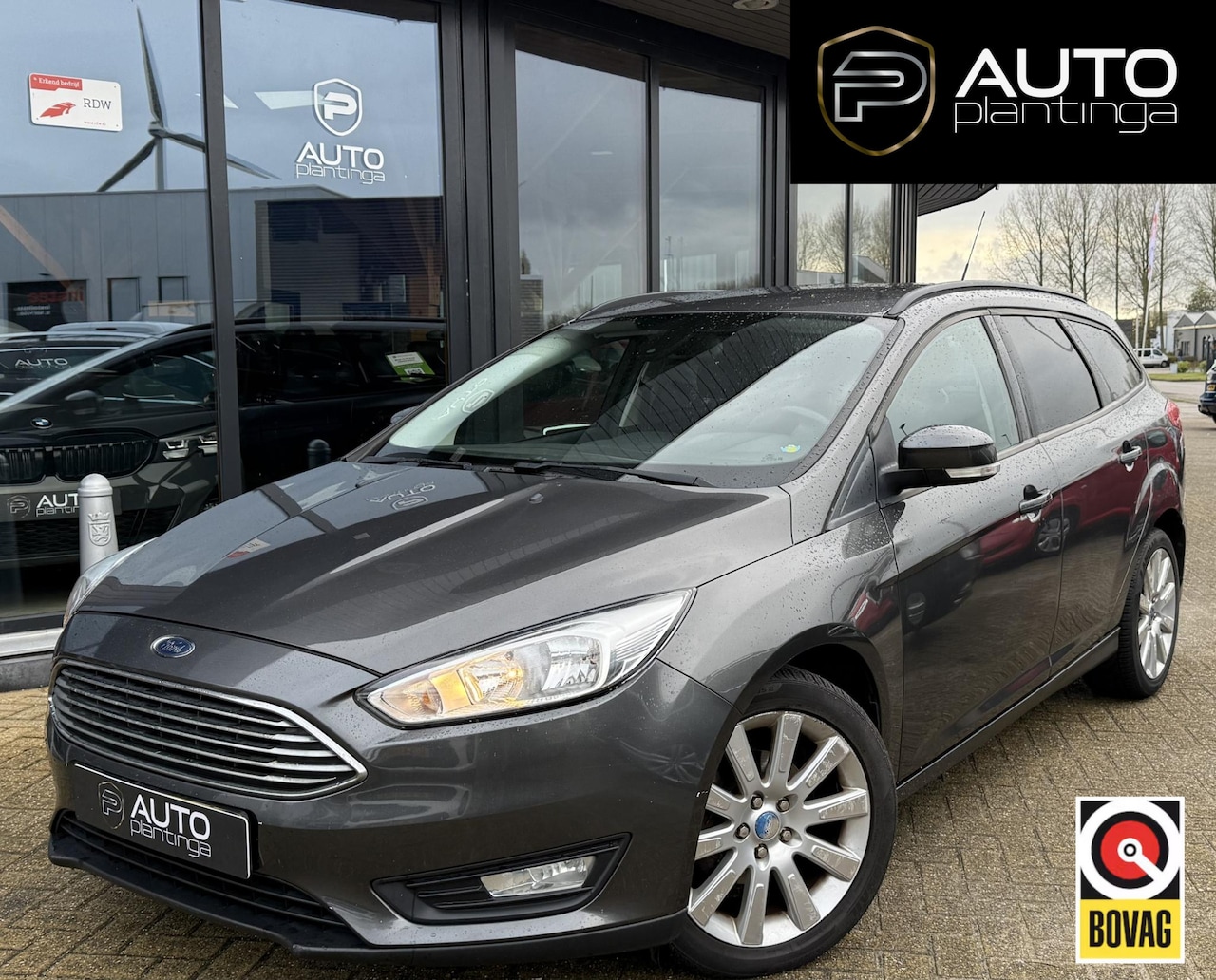 Ford Focus Wagon - 1.0 Titanium 125PK | Navgatie | Stoelverwarming | Airco | Cruise Control | Parkeersensoren - AutoWereld.nl