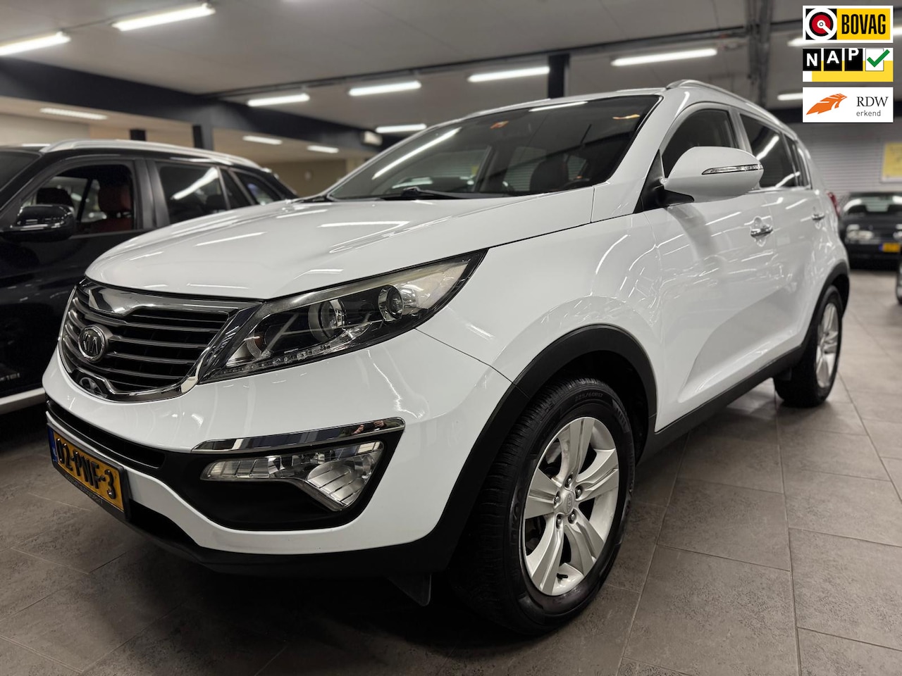 Kia Sportage - 2.0 X-ecutive Plus Pack navigatie half leer clima camera cruise controle lm-velgen elekt-p - AutoWereld.nl
