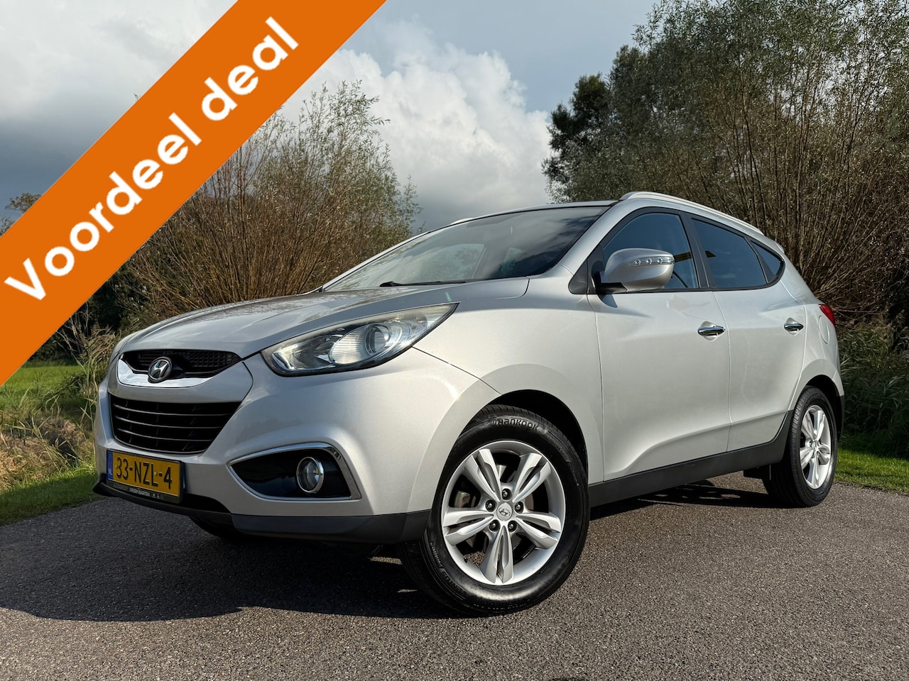 Hyundai ix35 - 2.0i Style | 1e Eigenaar | Leder | Clima | Stoelverwarming | 17" Velgen | BT/AUX/USB | Cru - AutoWereld.nl
