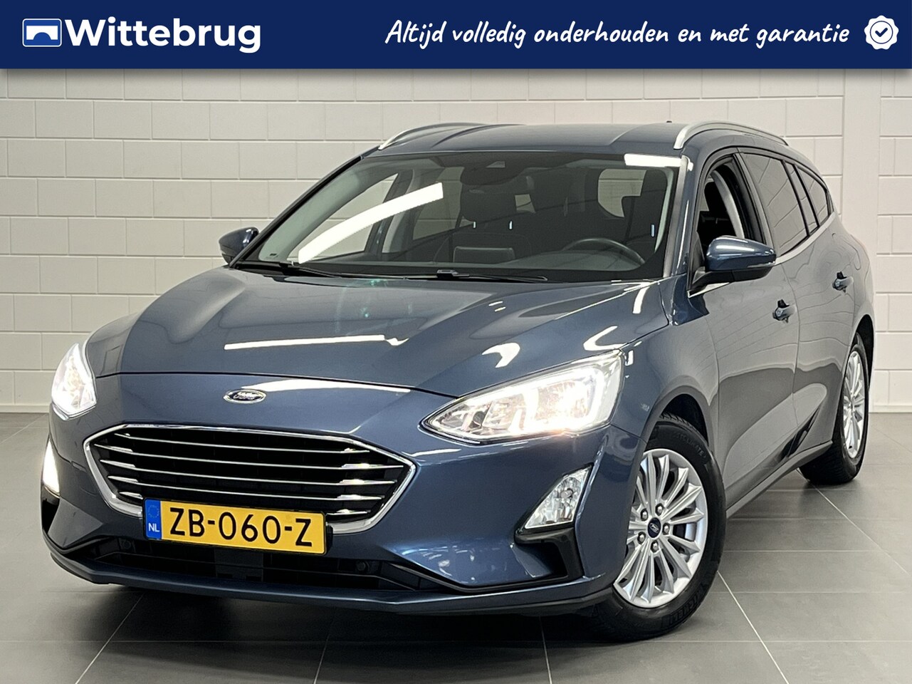 Ford Focus Wagon - 1.0 EcoBoost Titanium Business AUTOMAAT | NAVIGATIE | PARKEERSENSOREN - AutoWereld.nl