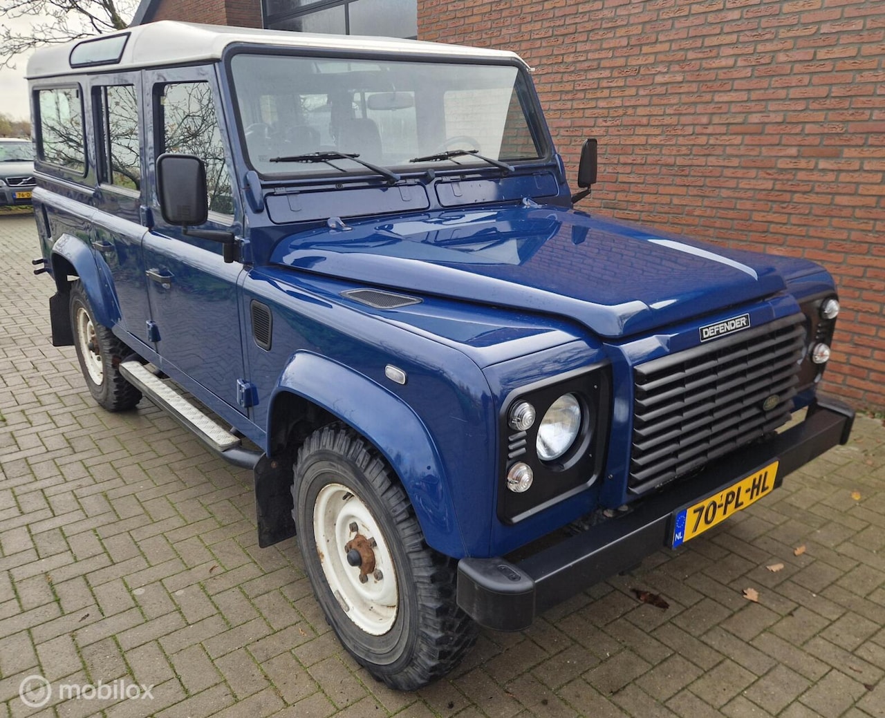 Land Rover Defender 110 - 2.5 TD5 - 9 pers - Airco - Stoelvw - AutoWereld.nl