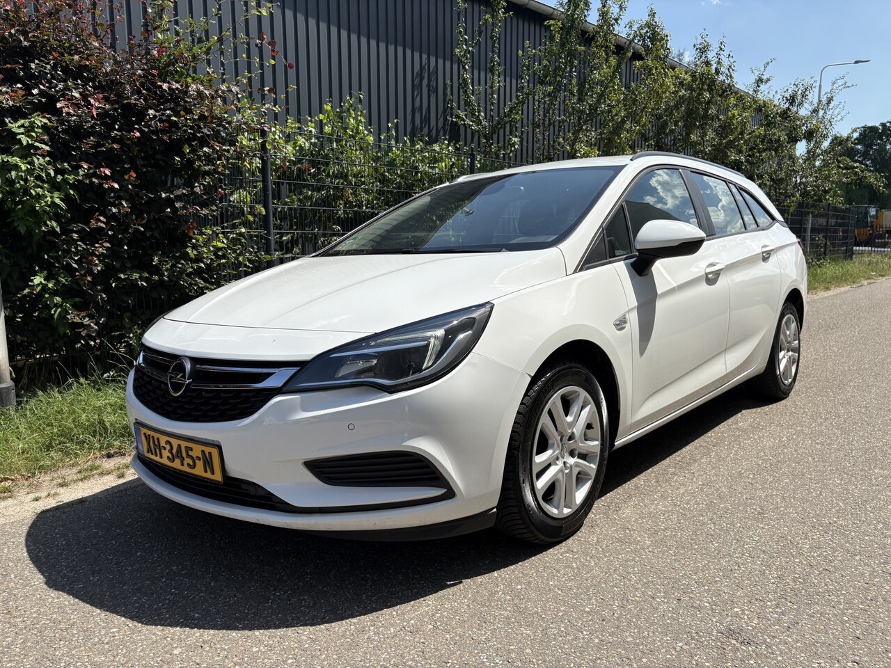 Opel Astra Sports Tourer - 1.0 Turbo Online Edition / NAVI / AIRCO / CRUISE - AutoWereld.nl