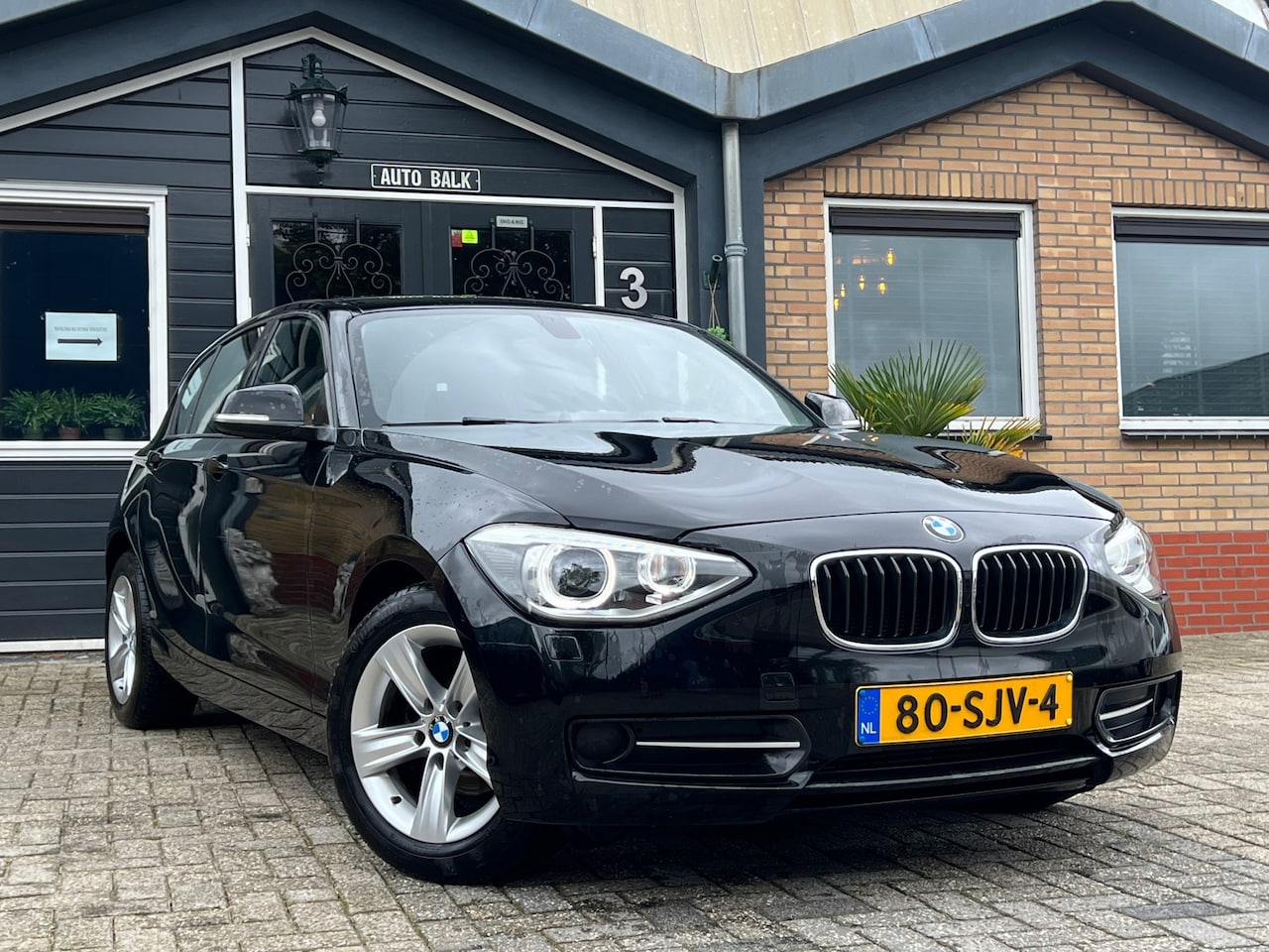 BMW 1-serie - 116i Sport | Cruise + Airco | - AutoWereld.nl