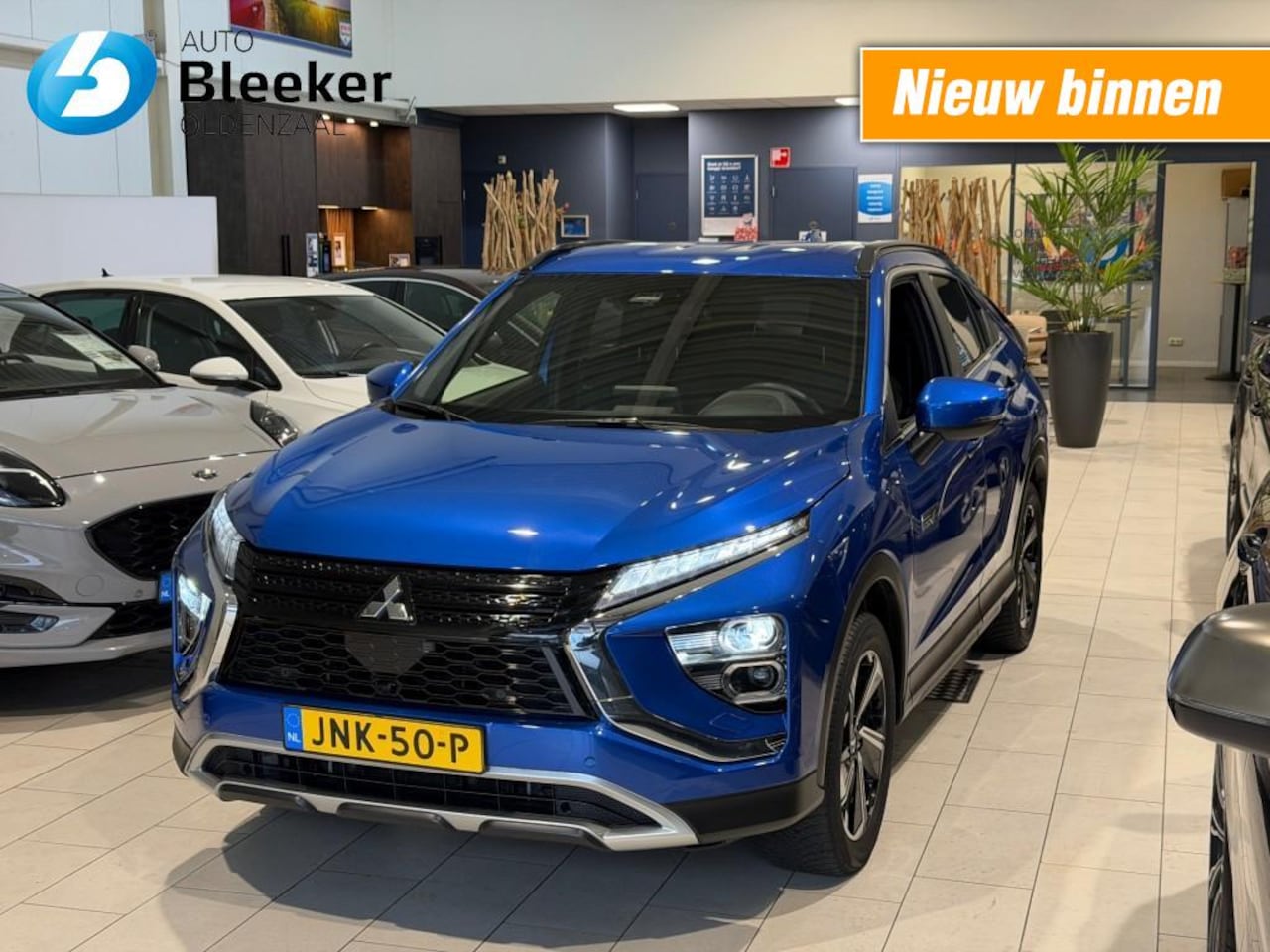 Mitsubishi Eclipse Cross - 2.4 PHEV 177 pk Intense Airco Electr stoel Cruise Camera Navi - AutoWereld.nl