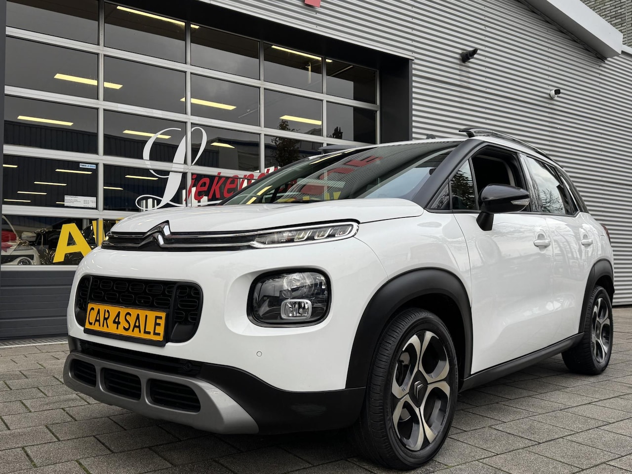 Citroën C3 Aircross - 1.2 PureTech S&S Shine Navigatie I Airco I Sport velgen I LED I PDC / Achteruitrij camera - AutoWereld.nl