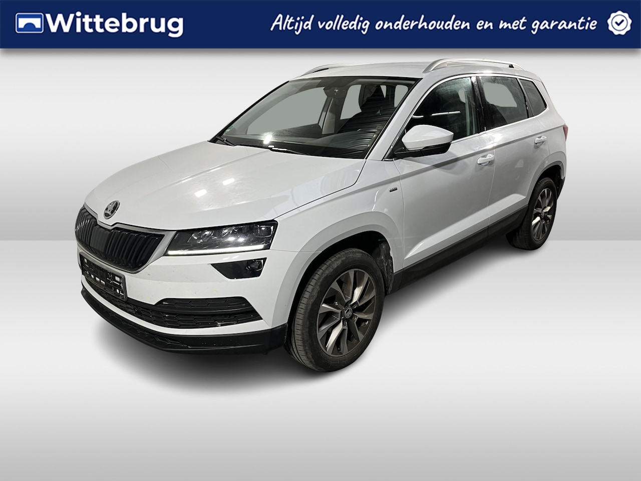 Skoda Karoq - 1.0 TSI Ambition / CRUISE/ SMARTLINK/ PARK. SENSOREN + CAMERA/ CLIMA/ STOEL VERWARM./ BLUE - AutoWereld.nl
