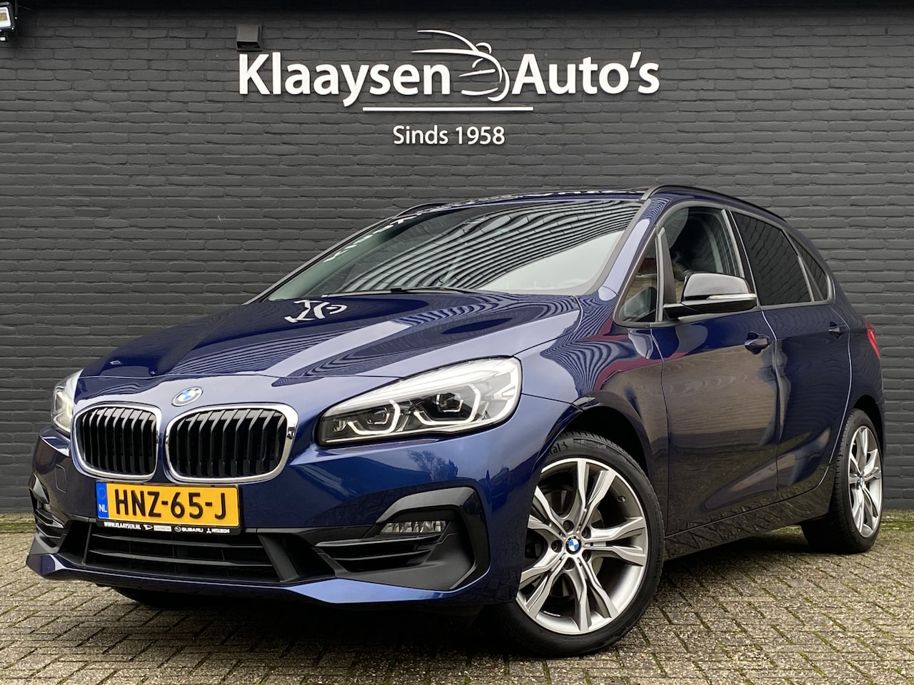 BMW 2-serie Active Tourer - 220i High Executive Edition 192 pk M-sport AUT. | dealer onderhouden | navigatie | trekhaa - AutoWereld.nl