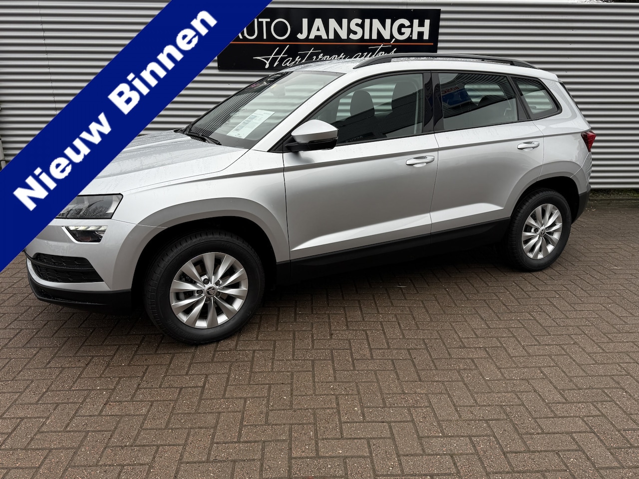 Skoda Karoq - 1.0 TSI Ambition | Airco | Cruise control | Navigatie | Trekhaak | LM Velgen | PDC achter - AutoWereld.nl