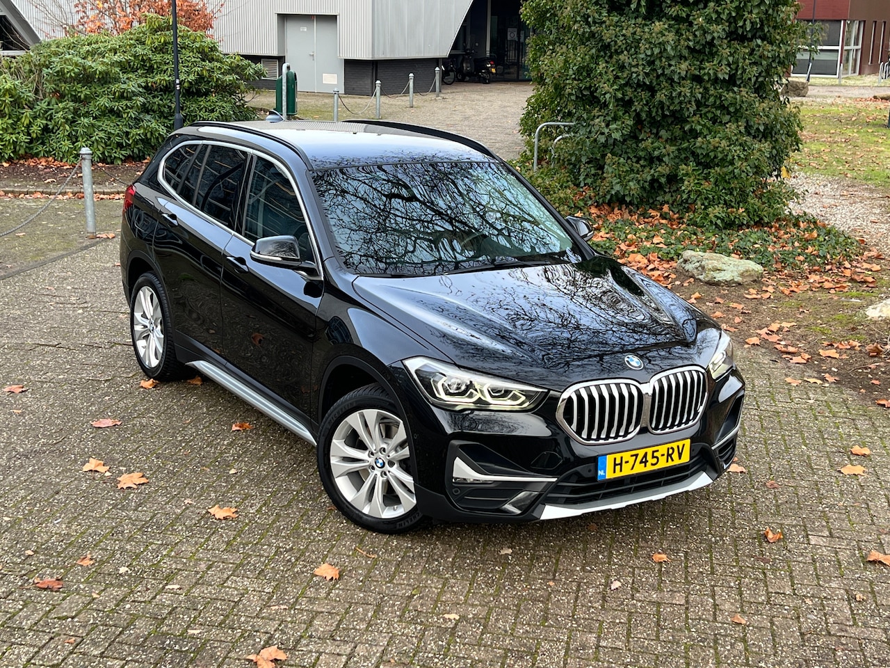 BMW X1 - 2.0i sDrive High Executive 192pk Automaat - xLine - Leer - Stoelverwarming - Climate Control - Trekhaak - - AutoWereld.nl