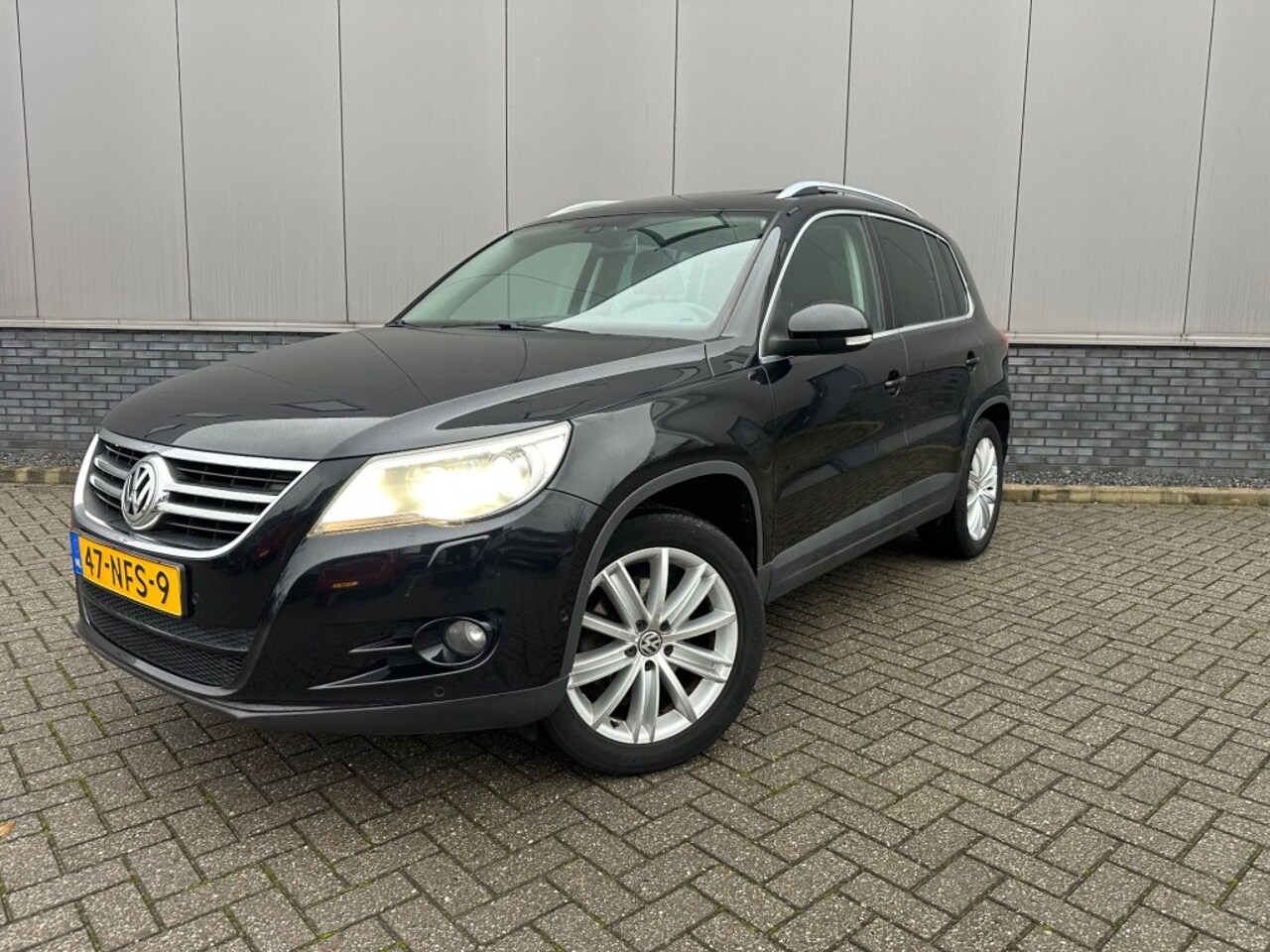 Volkswagen Tiguan - 1.4 TSI SportenStyle+a camera en Pano dak - AutoWereld.nl
