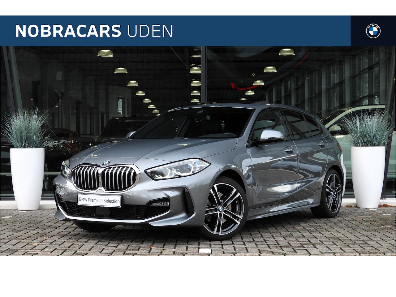 BMW 1-serie - 118i High Executive M Sport Automaat / Panoramadak / Trekhaak / Sportstoelen / Achteruitri - AutoWereld.nl