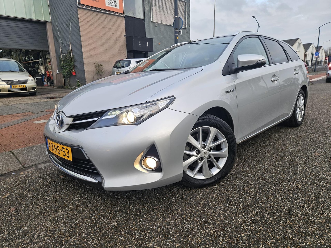 Toyota Auris Touring Sports - 1.8 Hybrid Lease GARANTIE LEER Bekleding - AutoWereld.nl