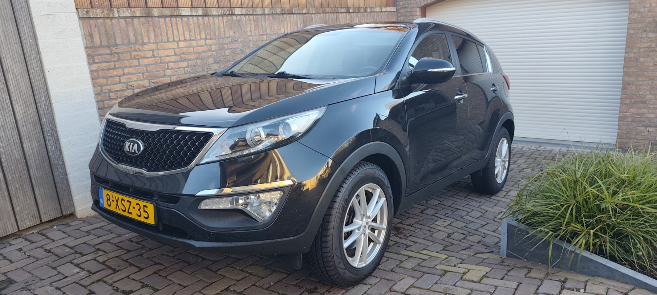 Kia Sportage - 1.6 GDI BusinessLine Clima Navi Camera 108973 km - AutoWereld.nl