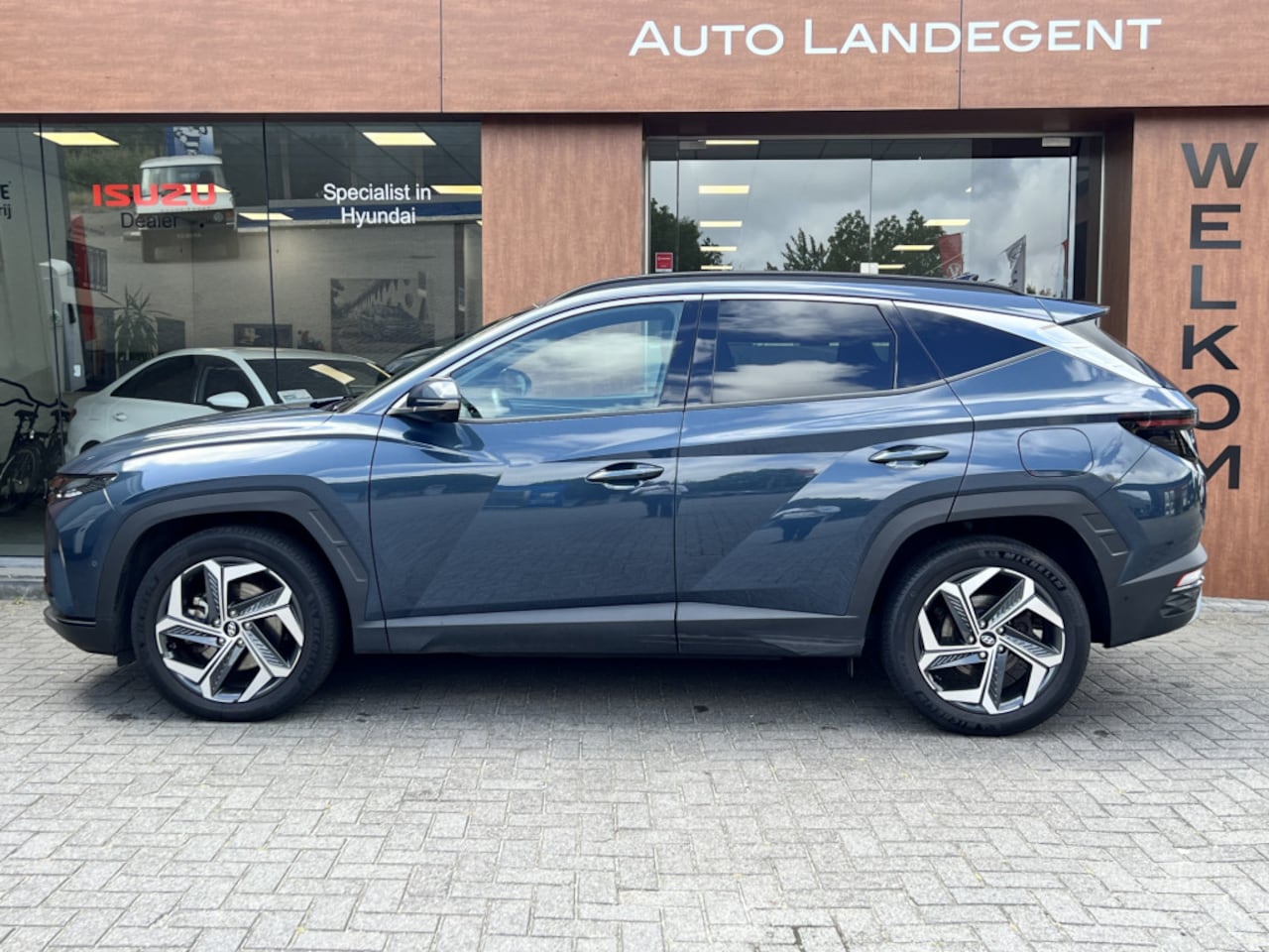 Hyundai Tucson - 1.6 T-GDI PHEV Premium 4WD | Stoel / stuur verwarming | Apple / android auto | 360 Camera - AutoWereld.nl