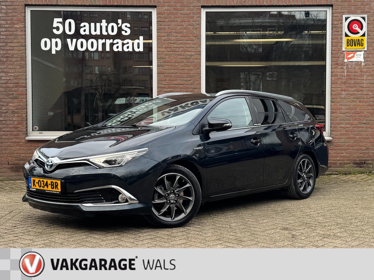 Toyota Auris Touring Sports - 1.8 Hybrid Executive | Pano | Navi | Cruise | Clima | PDC | Velgen - AutoWereld.nl