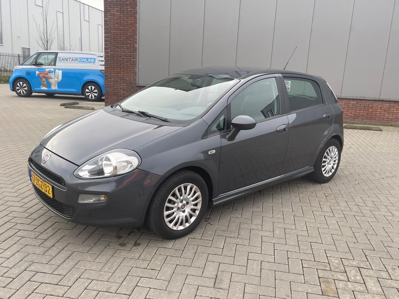Fiat Punto Evo - 1.3 M-Jet Pop Clima Grijs 2015 - AutoWereld.nl
