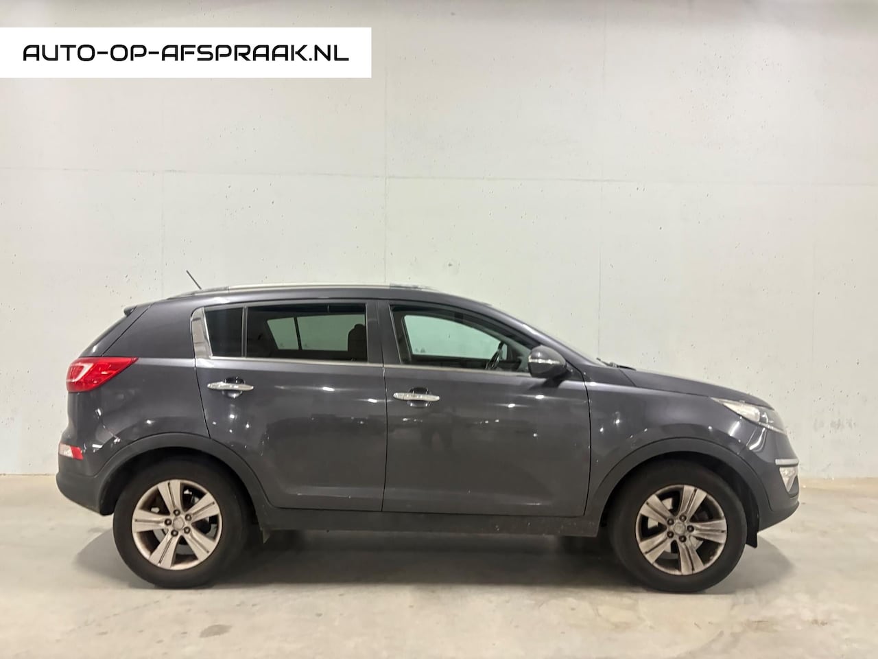 Kia Sportage - 1.6 GDI Plus Pack Airco Clima Cruise Control Trekhaak - AutoWereld.nl