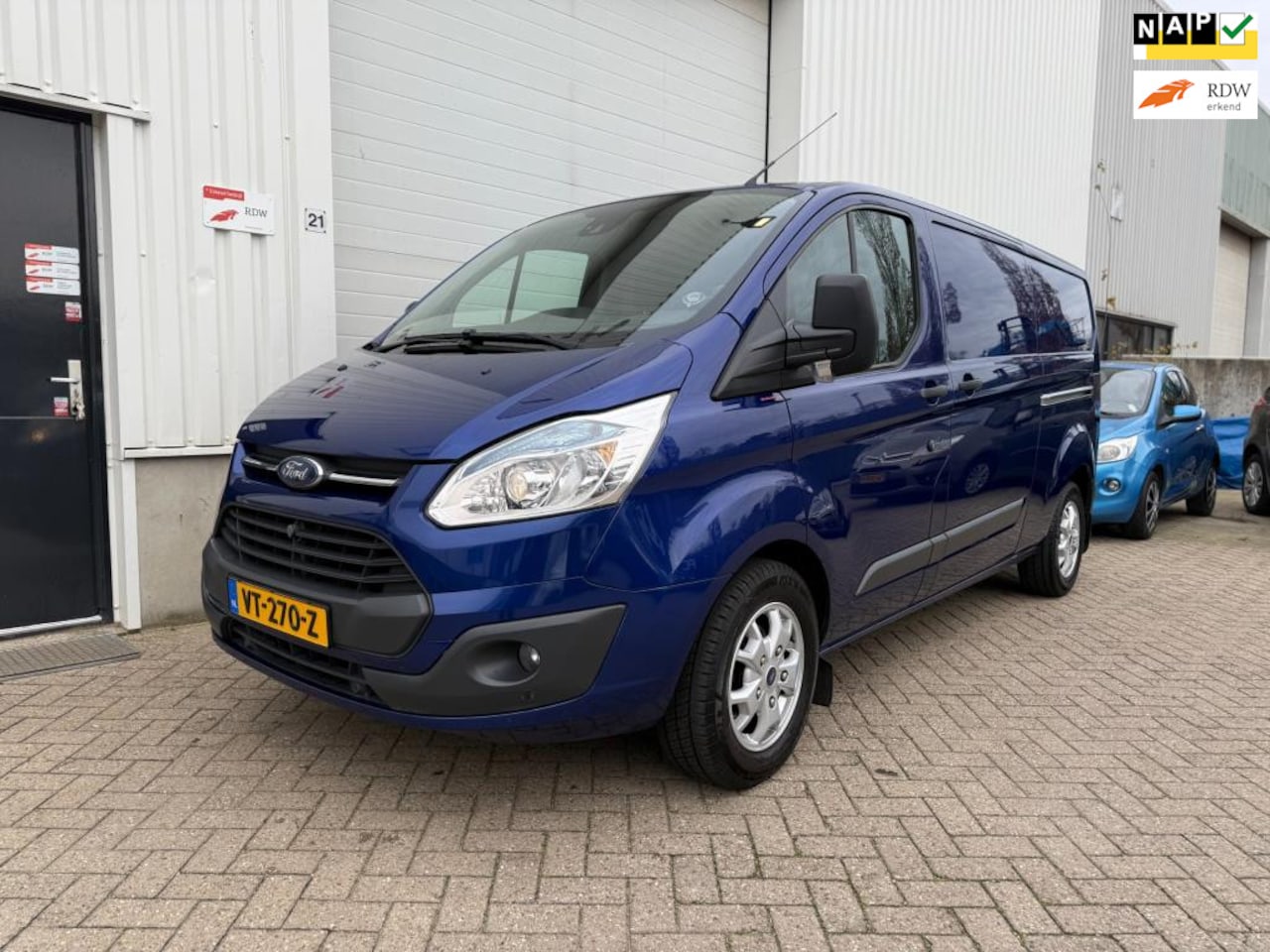 Ford Transit Custom - 290 2.2 TDCI L2H1|AIRCO|LMV|CRUISE|2X DEUR|PDC|TREKHAAK|DEALER|NAP|DAKDRAGERS ORIGINEEL|BT - AutoWereld.nl