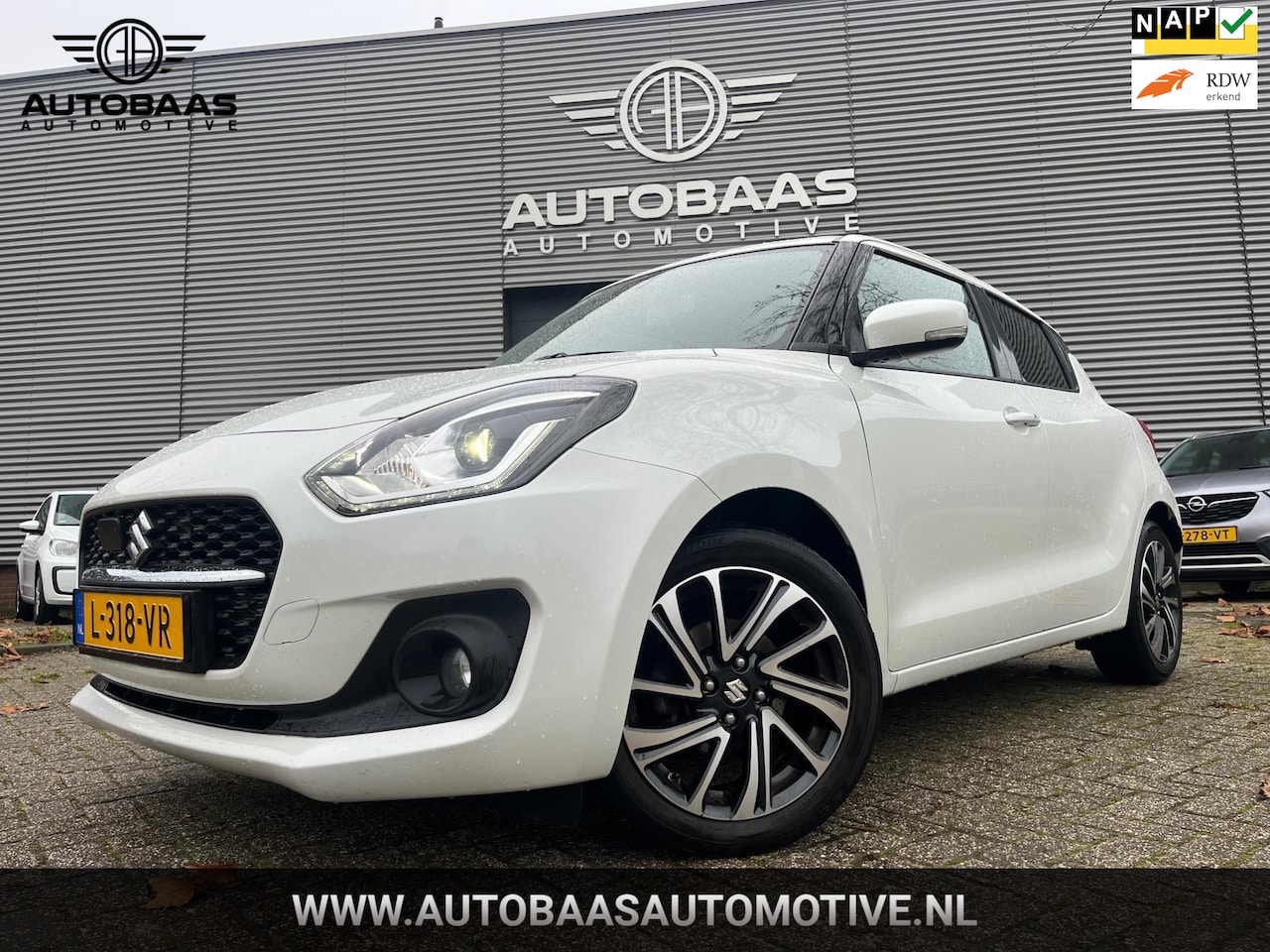 Suzuki Swift - 1.2 Style Smart Hybrid AUTOMAAT **APK 08-2027** NL-AUTO+NAP+1EIG+NAVI+STOELVERWARMING+FULL - AutoWereld.nl