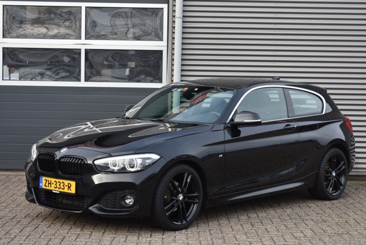 BMW 1-serie - 118I HIGH EXECUTIVE / M PAKKET / LEDER / NAVI  / STOELVERWARMING - AutoWereld.nl
