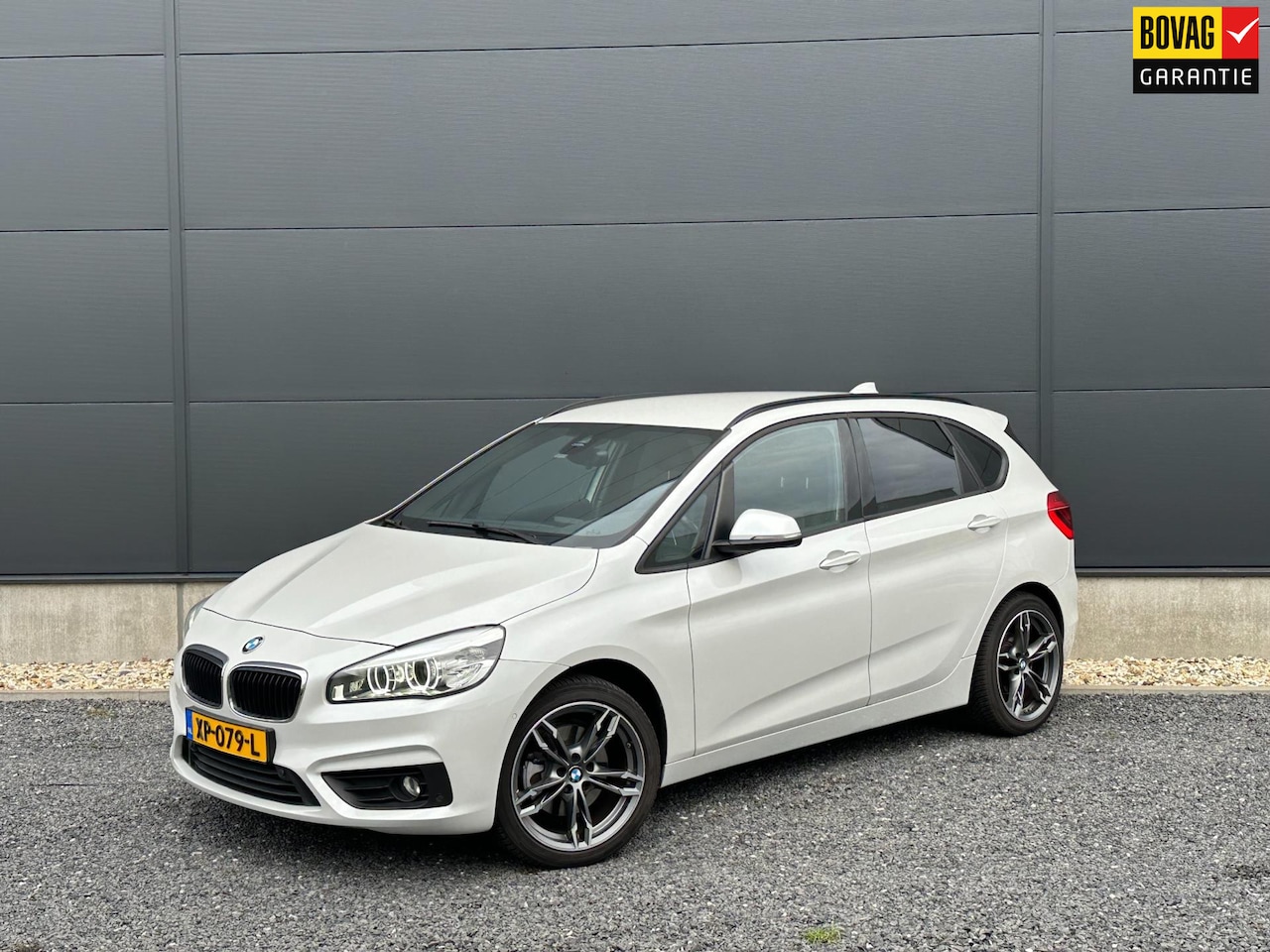 BMW 2-serie Active Tourer - 220i High Executive Clima | Navi | Leder - AutoWereld.nl
