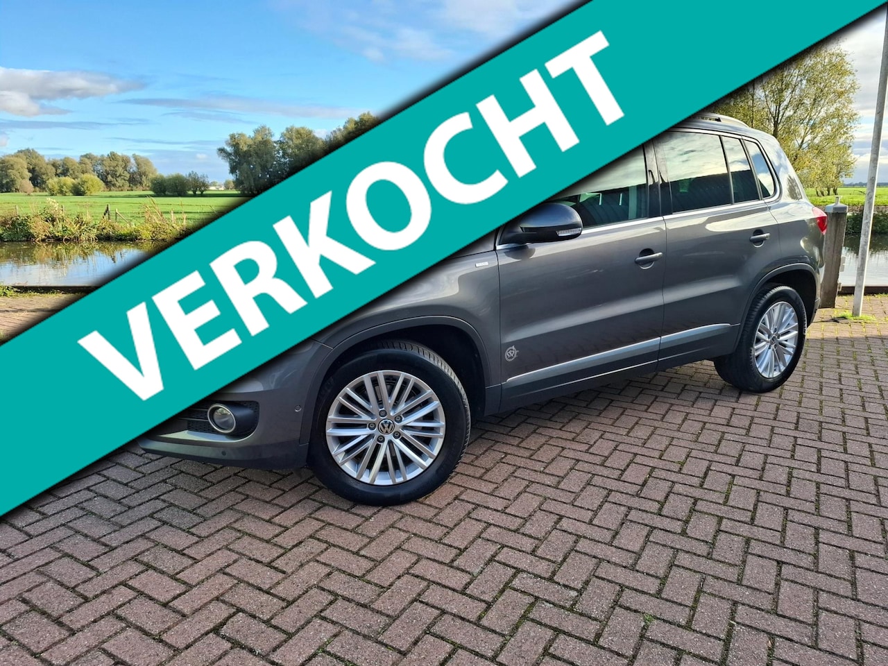 Volkswagen Tiguan - 1.4 TSI Sport&Style Clima Stoelverw. PDC V+A - AutoWereld.nl