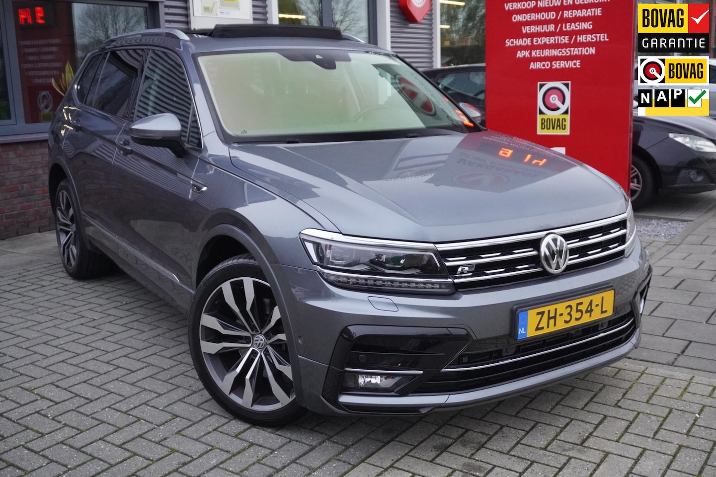 Volkswagen Tiguan Allspace - 2.0 TSI 4Motion Highline Business R-Line 7p ; Pano / Massage / Voorruitverwarming / ACC / - AutoWereld.nl