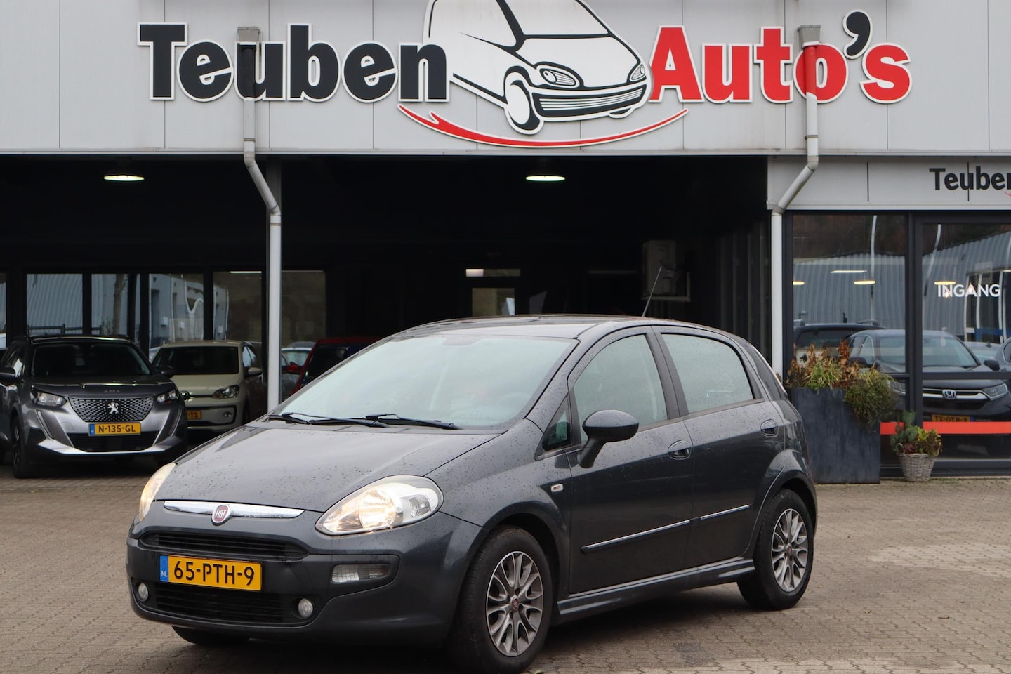 Fiat Punto Evo - 1.3 M-Jet Dynamic Airco, Trekhaak, Cruise control, Elektrische ramen - AutoWereld.nl