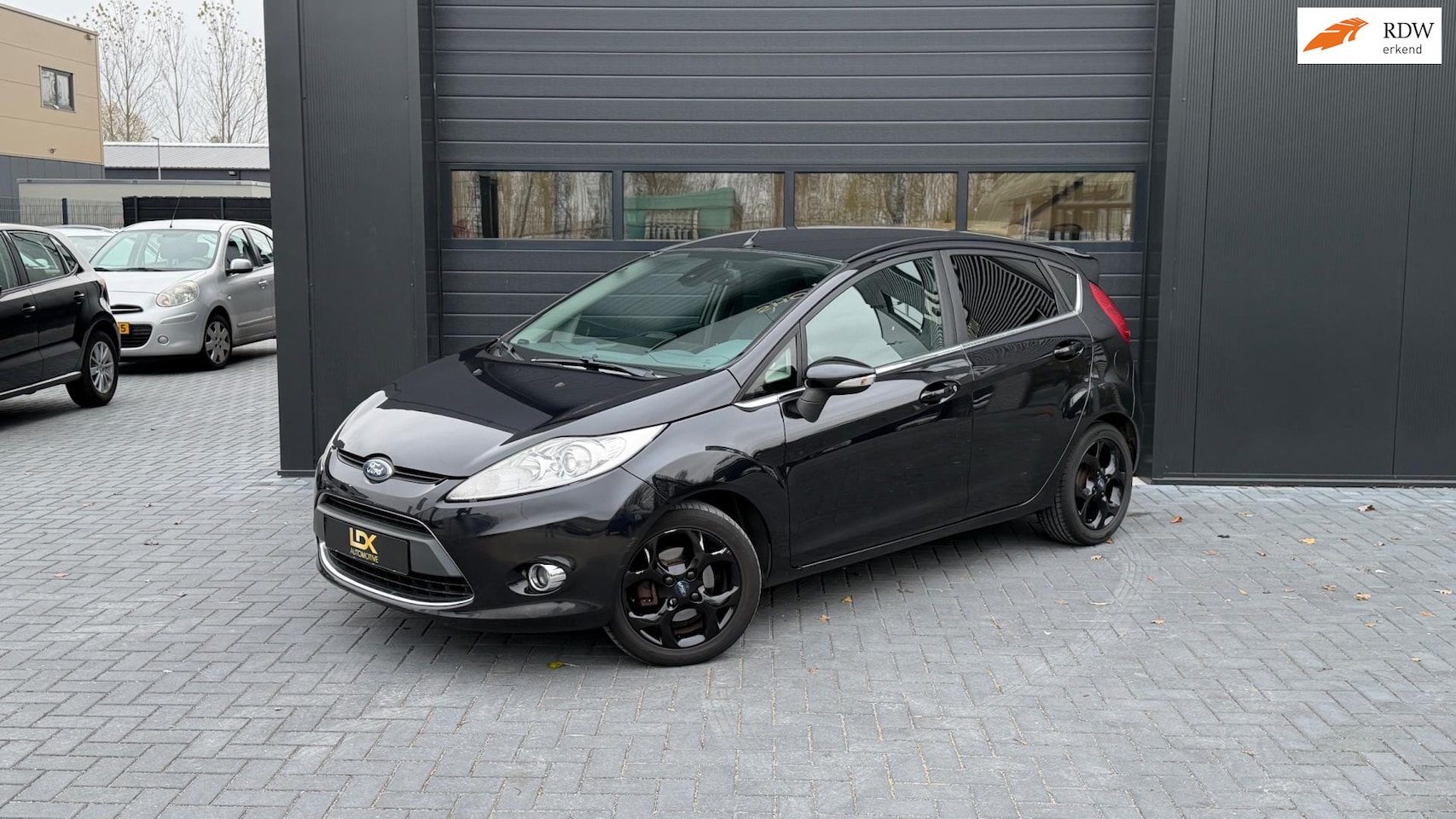 Ford Fiesta - 1.6 Ghia Airco|Cruise|Stoelverwarming|P sensor - AutoWereld.nl