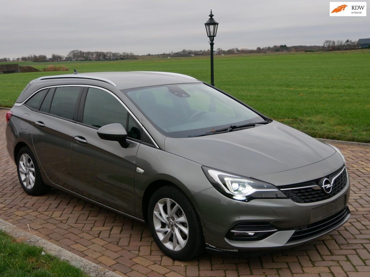Opel Astra Sports Tourer - 1.5 CDTI Elegance CLIMA ALU LEATHER ** 6499 NETTO ** - AutoWereld.nl