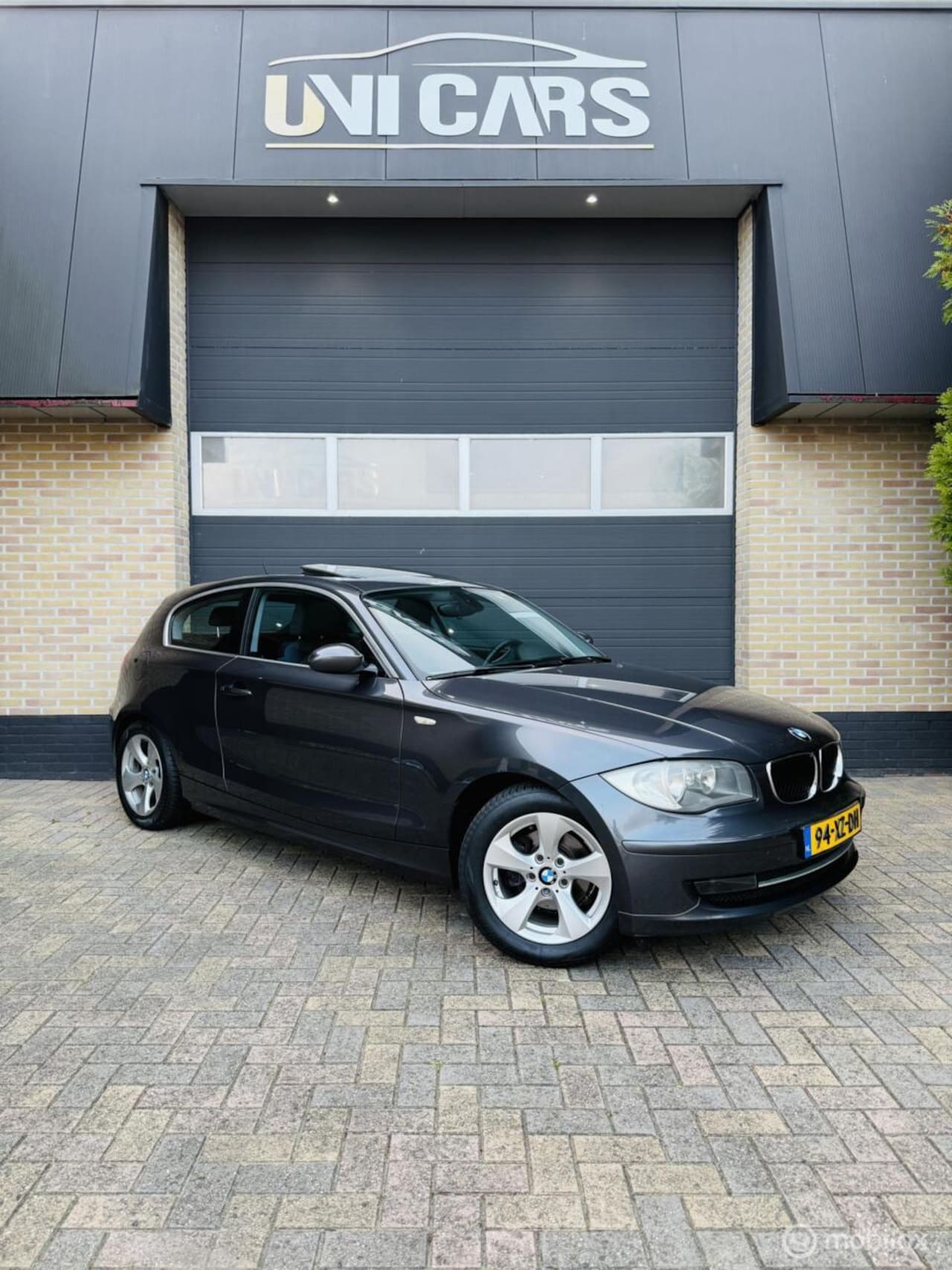 BMW 1-serie - 116i High Executive|Opendak|Cruis|Airco|PDC|LM16 - AutoWereld.nl