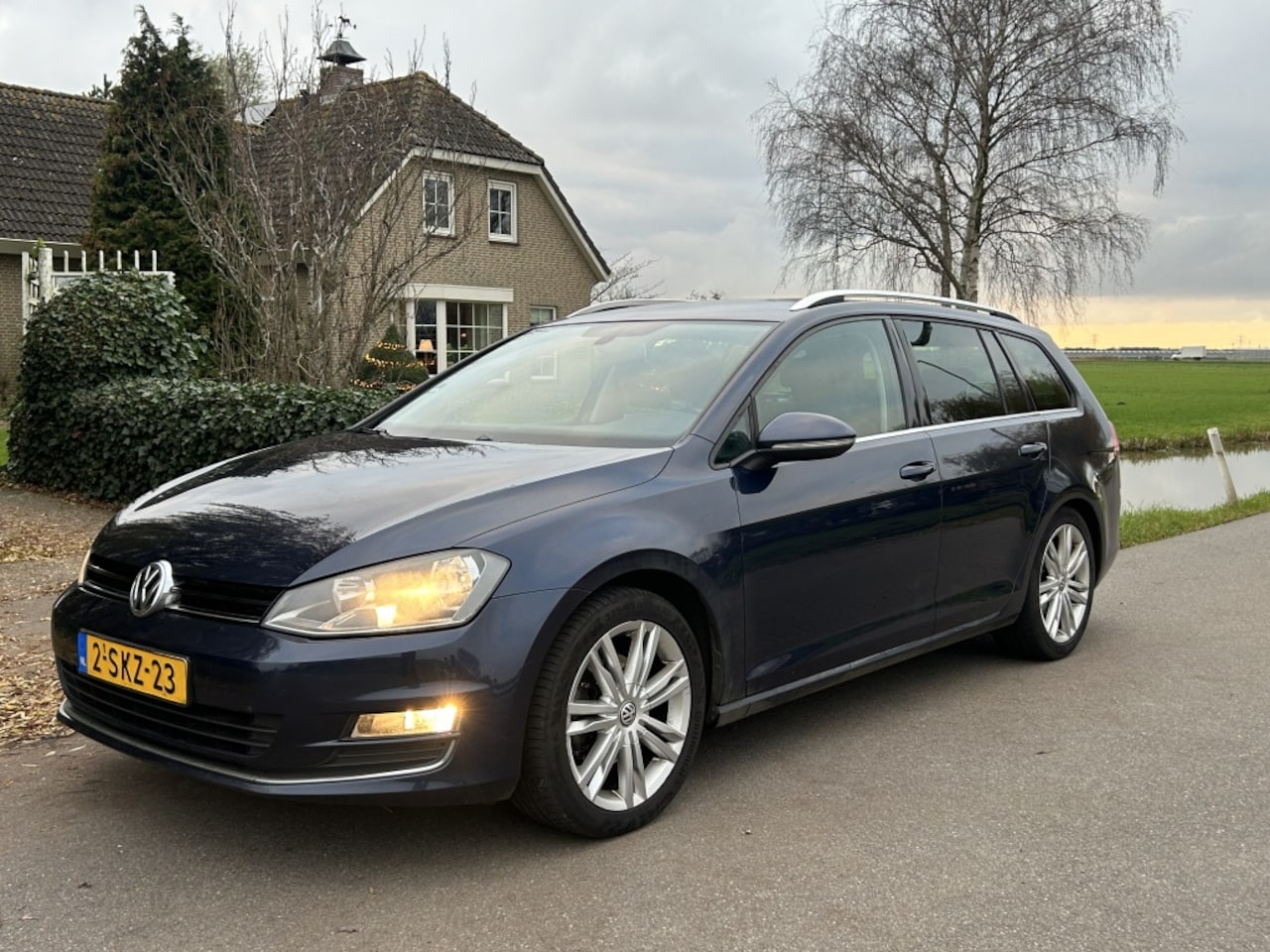Volkswagen Golf Variant - 1.6 TDI *AUTOMAAT* Highline Navi BT - AutoWereld.nl